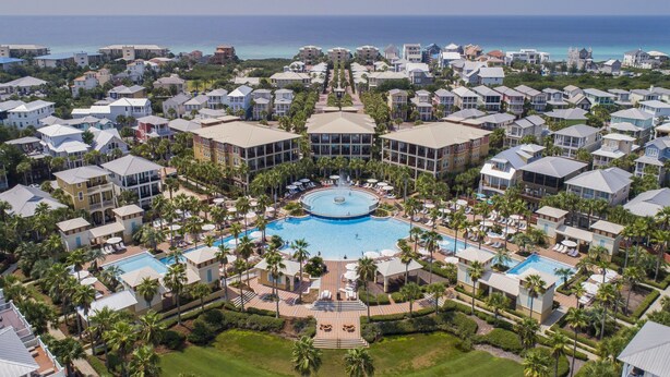 A resort with multiple buildings, a central pool, and a view of the ocean. - Updated Kitchen & Large Pool– Seacrest Simplicity Meets Coastal Comfort (Inlet Beach)
