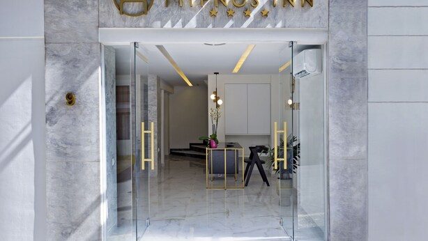 The entrance to a hotel with a marble floor, a glass door, and a sign reading "HYPNOS INN". - Hypnos Inn Athens (Athens)