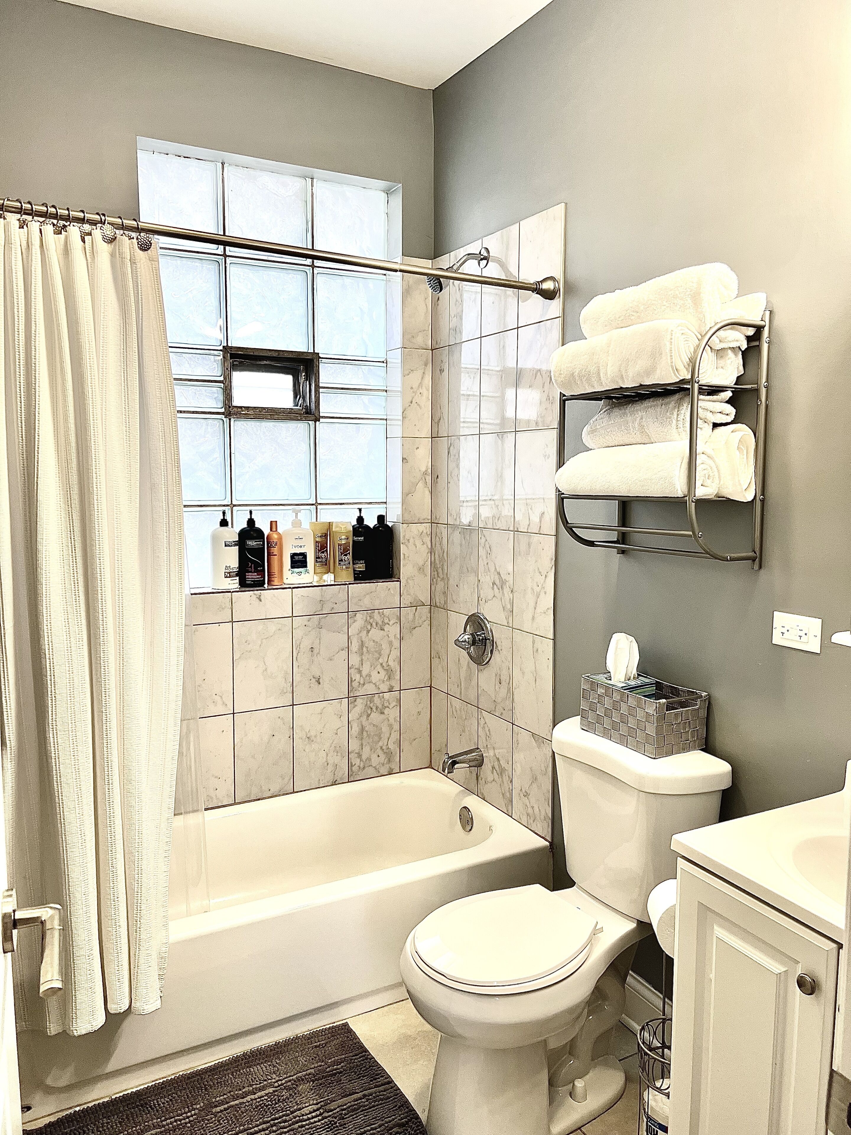 Combined shower/tub, towels, soap, shampoo