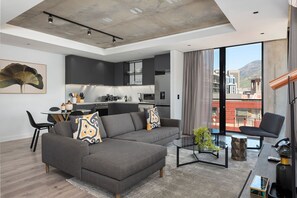 Business Studio | Living area | 42-inch flat-screen TV with cable channels, TV, Netflix - The Signature 413 (Cape Town)