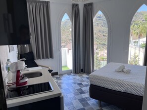 1 bedroom, desk, iron/ironing board, travel cot