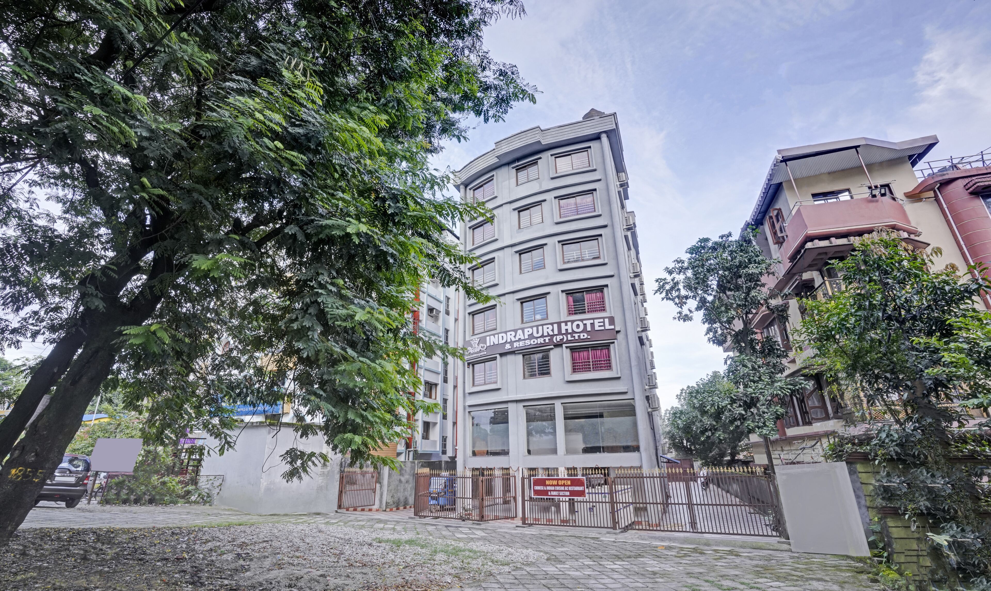 A multi-story hotel with a sign reading "INDRAPURI HOTEL & RESORT (P) LTD."