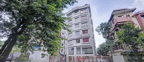 A multi-story hotel with a sign reading "INDRAPURI HOTEL & RESORT (P) LTD."