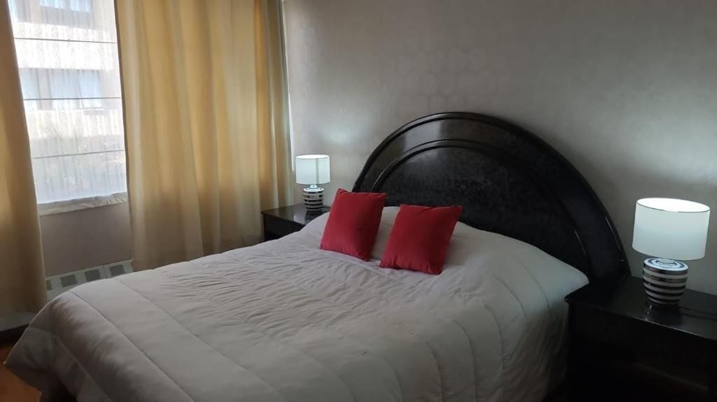 deluxe studio suite | premium bedding, desk, laptop workspace, iron/ironing board