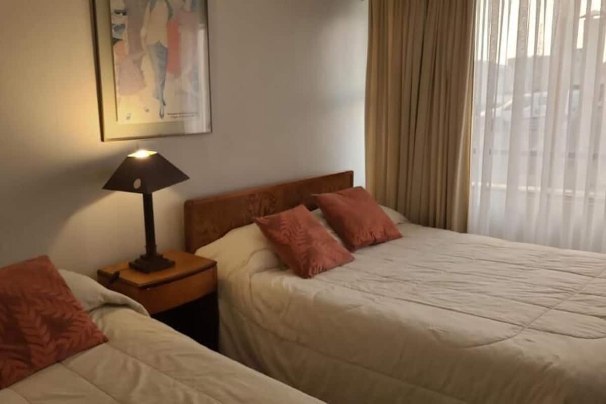 Family Room | Premium bedding, desk, laptop workspace, iron/ironing board