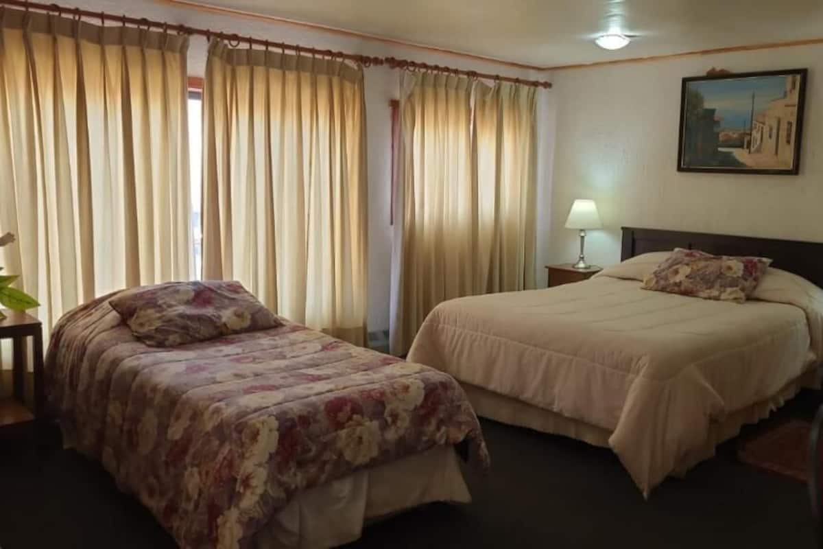 Family Apartment | Premium bedding, desk, laptop workspace, iron/ironing board