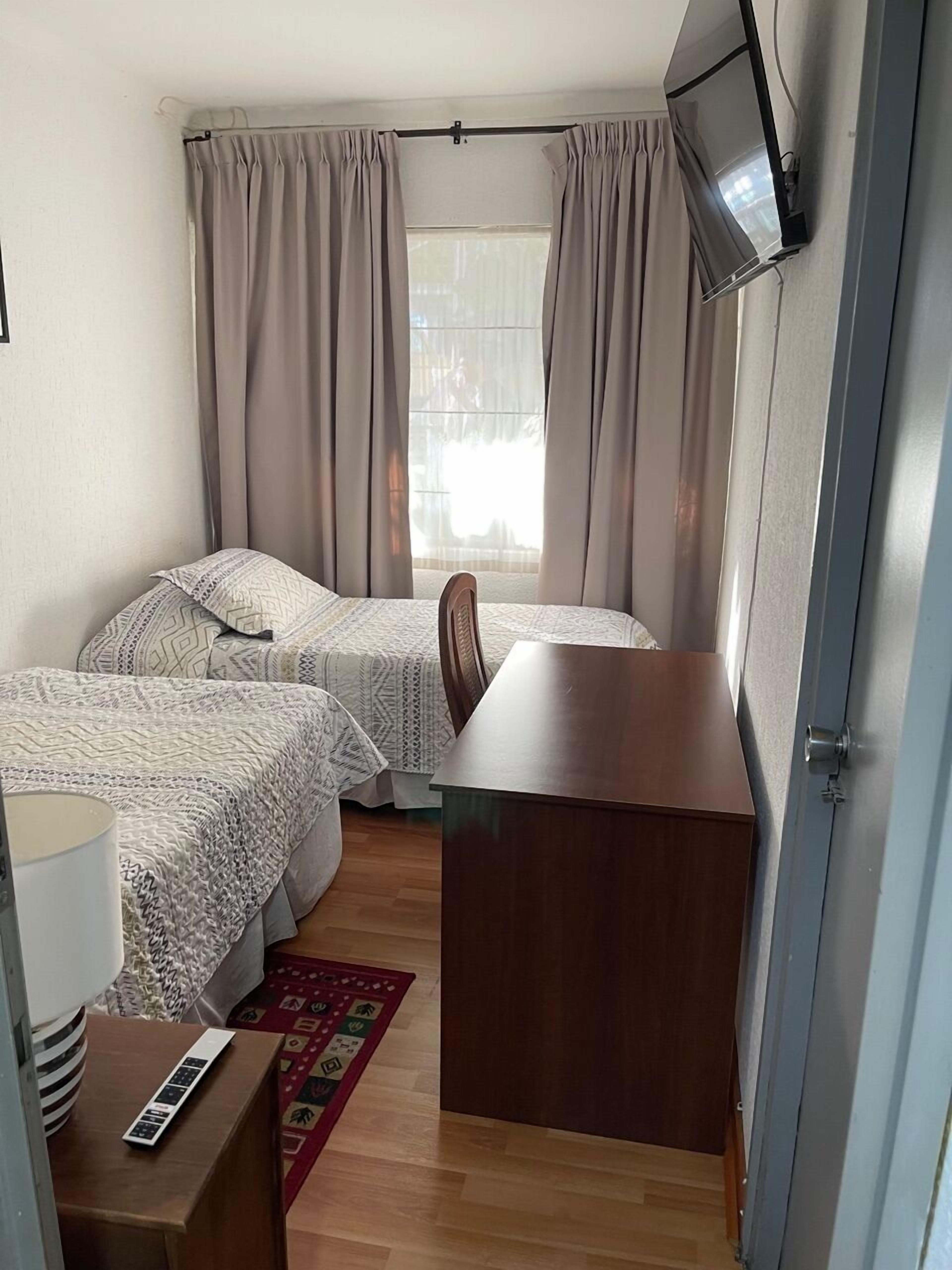 family duplex | premium bedding, desk, laptop workspace, iron/ironing board