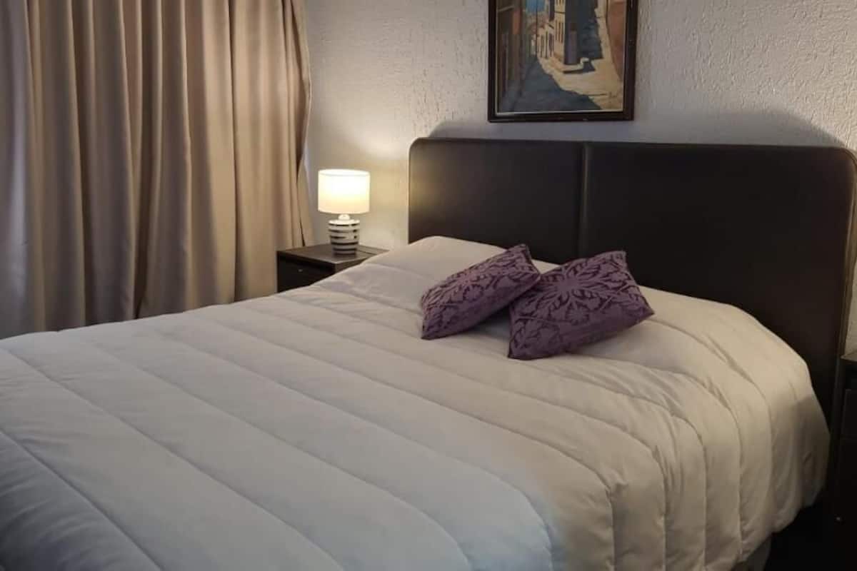 family duplex | premium bedding, desk, laptop workspace, iron/ironing board