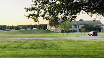 Stroll through the well-manicured grounds, surrounded by a modern building with large windows.