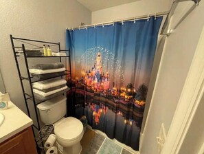 Bathtub, hair dryer, towels, soap