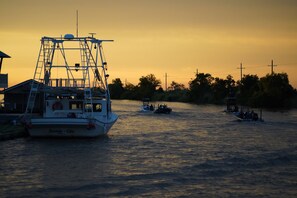 A river with boats docked at a marina. - Paradise with Space  Dularge DeLight Sleeps 8 Houma by Falgout Marina (Dularge)