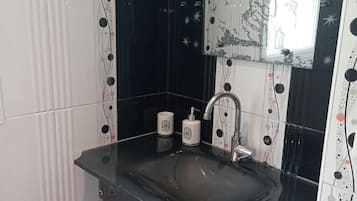 Shower, hair dryer, towels, toilet paper
