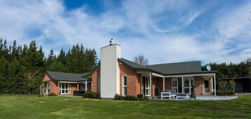 A two-story building with a brick facade and a flat roof.