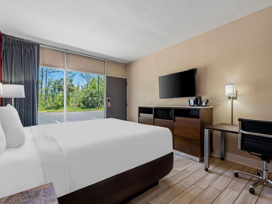 Premium bedding, desk, laptop workspace, soundproofing