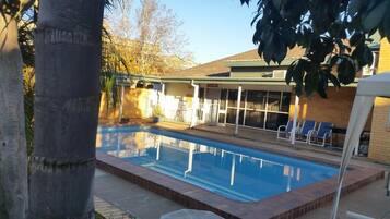Seasonal outdoor pool, pool umbrellas
