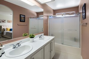 Combined shower/bathtub, hair dryer, towels, soap