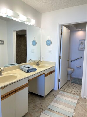 Combined shower/tub, hair dryer, towels, soap