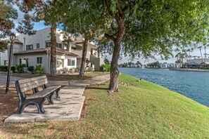 A waterfront property with a bench, a pathway, and a view of the water. - LAKE View Condo: Comm Htd POOL, Spa, Pickleball Cts, King Beds & TVs Both BRs (Chandler)