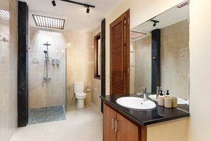Bathtub, hair dryer, towels, soap