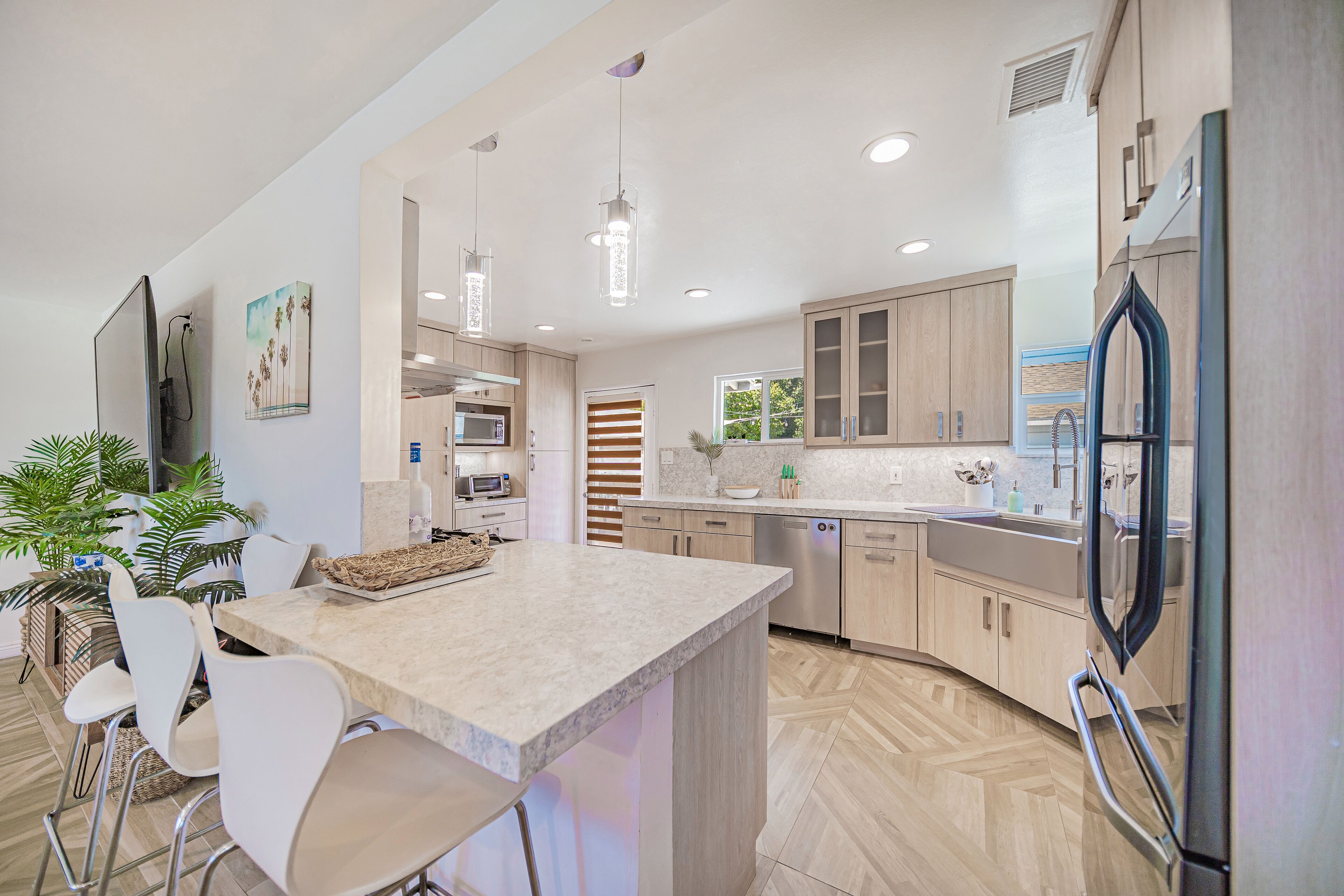 Countertop and Barstools connected to the kitchen.