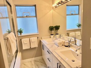 Combined shower/tub, hair dryer, towels, soap