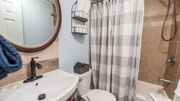 Combined shower/tub, hair dryer, bidet, towels