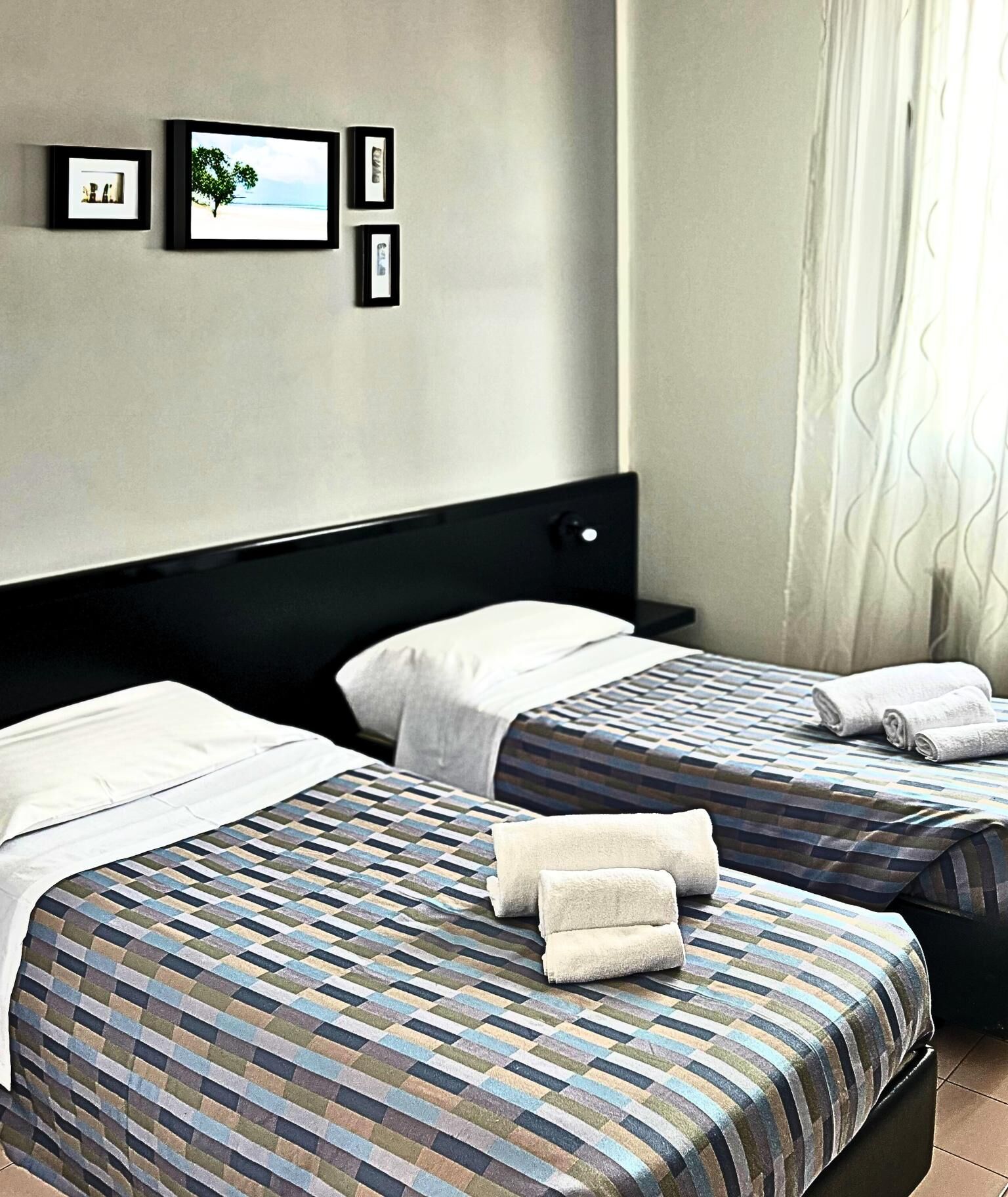 Basic Twin Room | Minibar, desk, laptop workspace, iron/ironing board