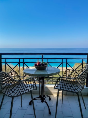 Outdoor dining. Apartment in a Hotel 'Sunset Premium Studio 2' with Sea View, Shared Pool, & Wi-Fi