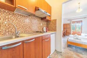 Fridge, microwave, stovetop, coffee/tea maker