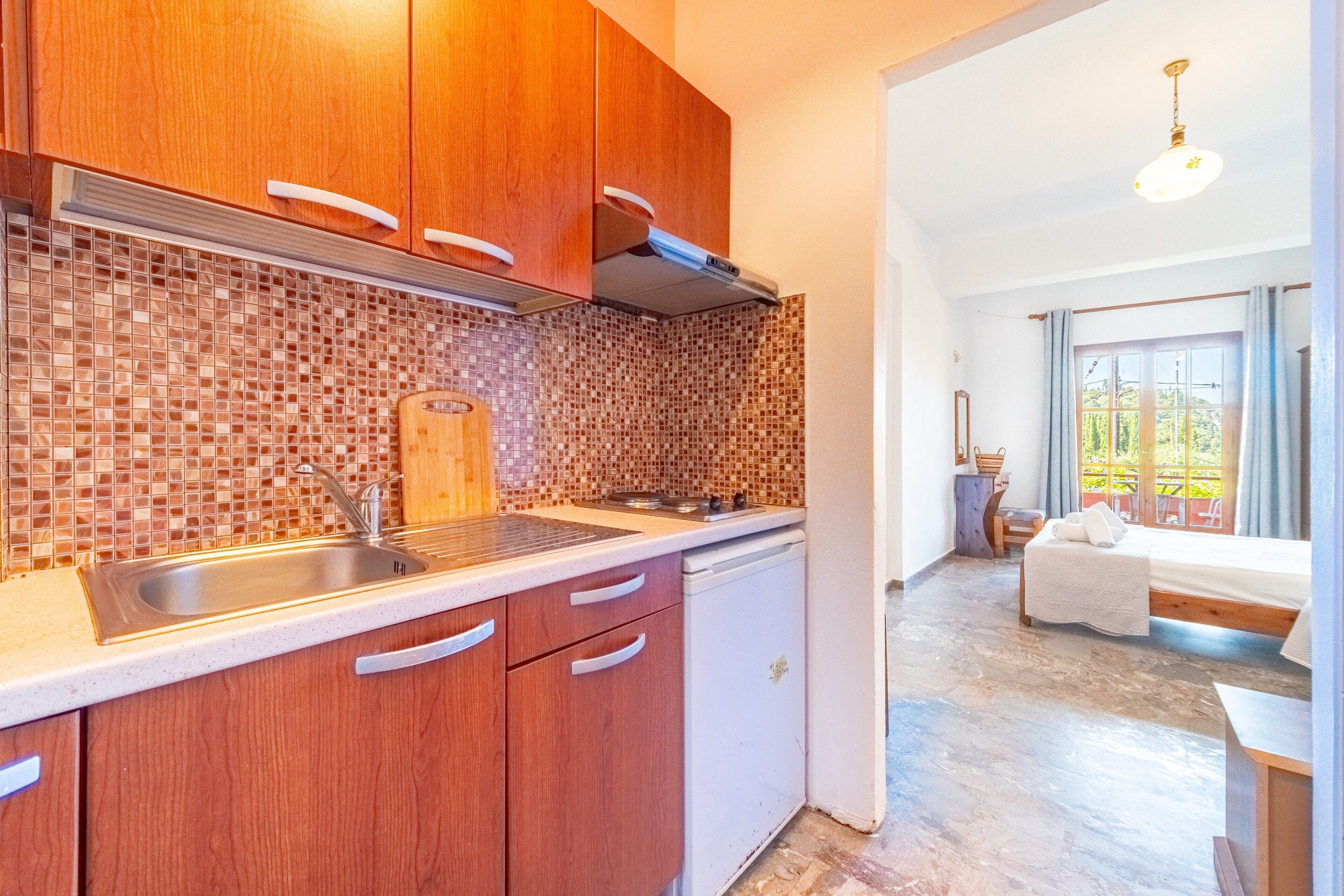Fridge, microwave, stovetop, coffee/tea maker