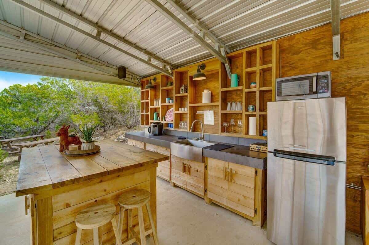 Fridge, microwave, coffee/tea maker, cookware/dishes/utensils