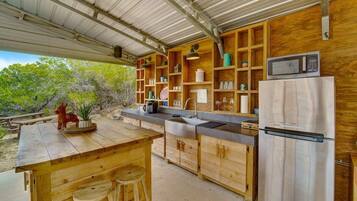 Fridge, microwave, coffee/tea maker, cookware/dishes/utensils