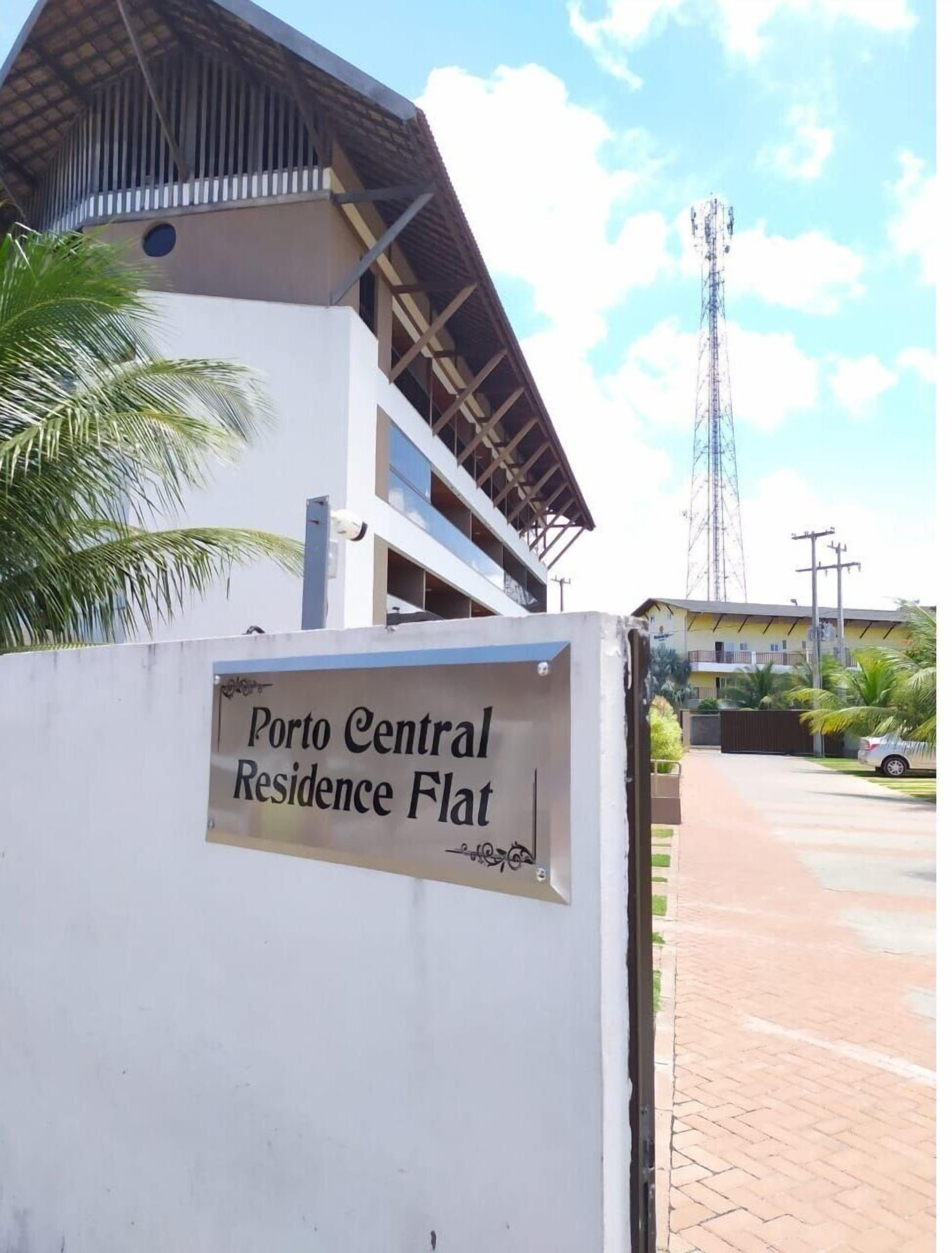 A building with a sign reading "Porto Central Residence Flat."