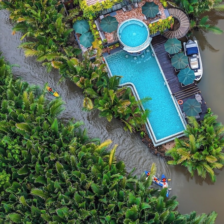 2 outdoor pools, open 8:00 AM to 10:00 PM, pool umbrellas, sun loungers. RiverTree Villa & Resort