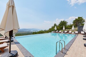 Seasonal outdoor pool, pool umbrellas, sun loungers