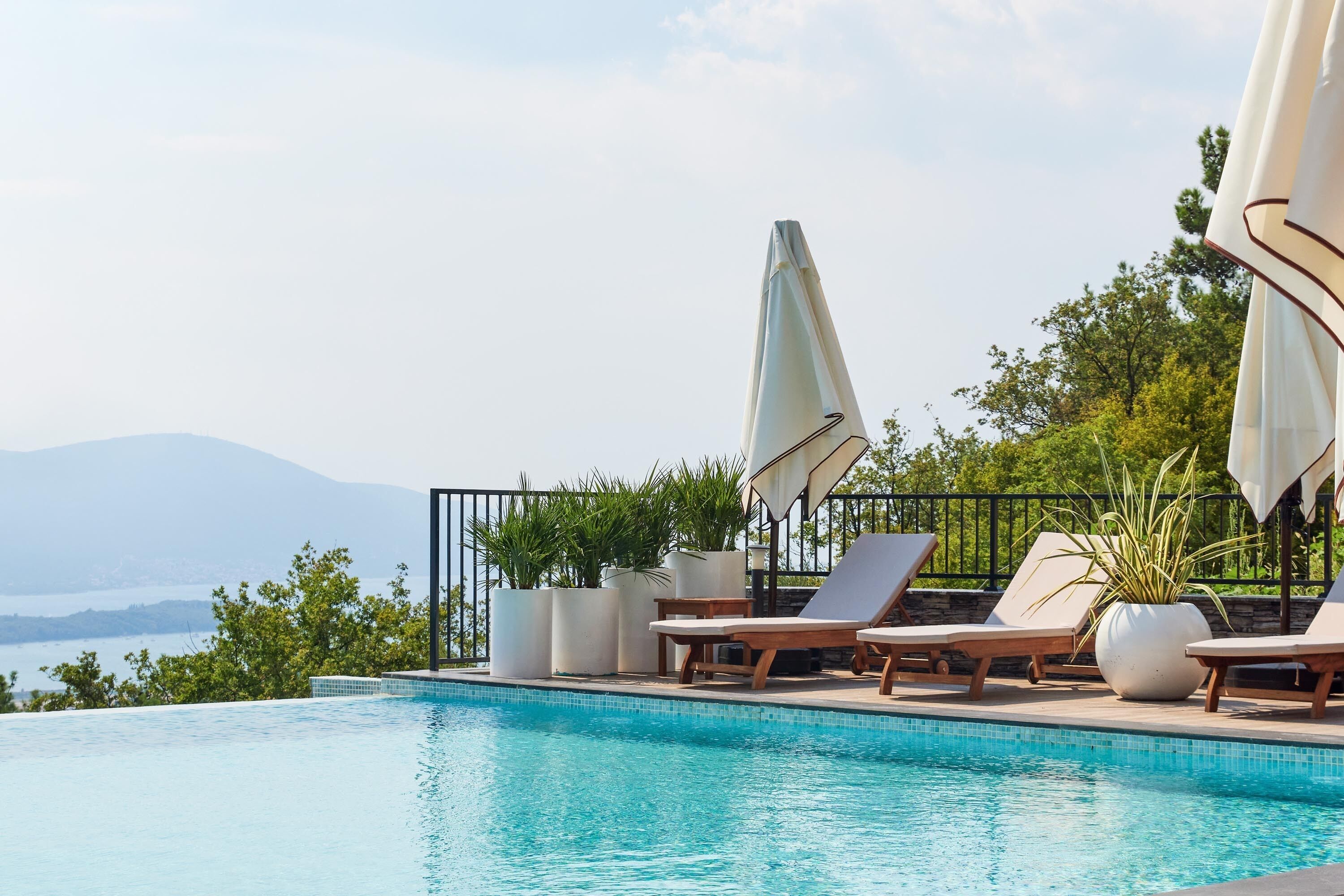 Seasonal outdoor pool, pool umbrellas, pool loungers