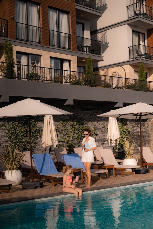 Seasonal outdoor pool, pool umbrellas, sun loungers