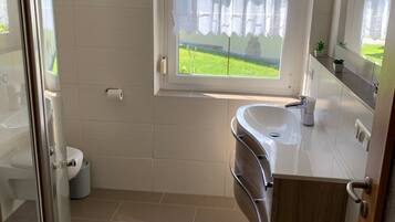 Shower, towels, soap, toilet paper