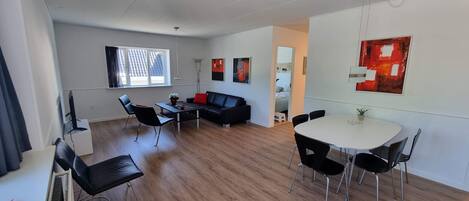 Deluxe Condo | Living room | 50-inch flat-screen TV with cable channels, TV