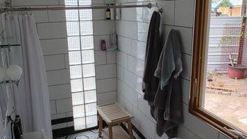 Combined shower/tub, hair dryer, towels, toilet paper