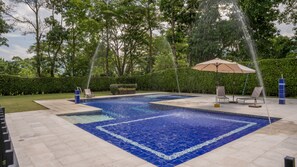 Outdoor pool, open 9:00 AM to 5:00 PM, pool umbrellas, pool loungers