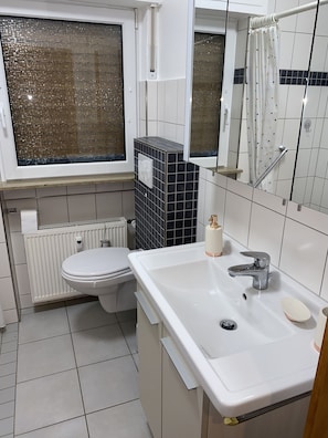 Shower, towels, soap, toilet paper