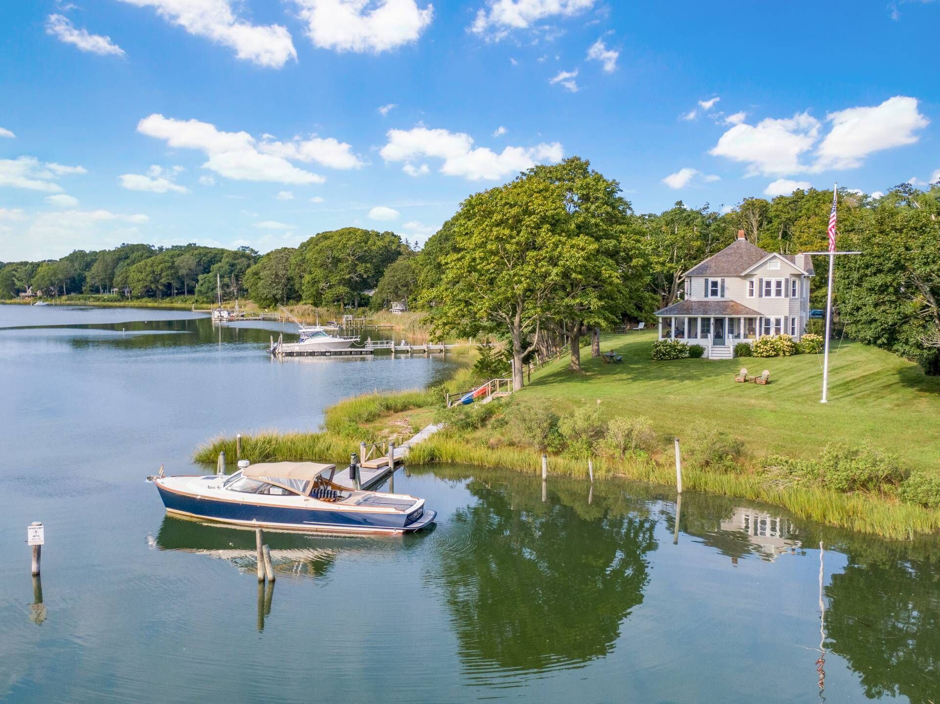 Waterfront farmhouse with dock and south and west sunset view.