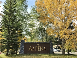 Welcome to The Aspens, nestled among mature trees in a serene natural setting.