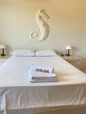 Familie vierpersoonskamer | Een minibar, individueel gedecoreerd, beddengoed