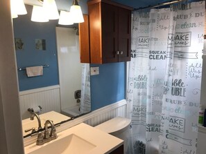 Bathtub, hair dryer, towels, soap