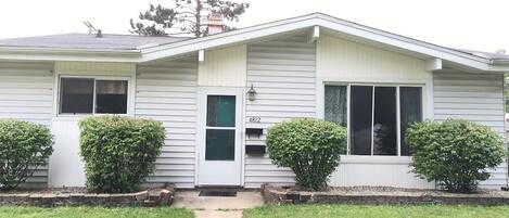 A single-story house with a front porch, a mailbox, and a number 4812 on the door.