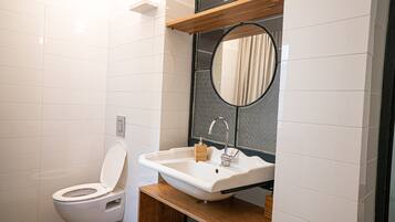 Shower, hair dryer, towels, toilet paper