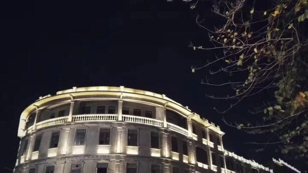 A historic building with a circular facade, multiple balconies, and classical architectural elements. - Hongxing Boutique Hotel (Shantou)