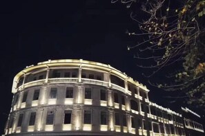 A historic building with a circular facade, multiple balconies, and classical architectural elements. - Hongxing Boutique Hotel (Shantou)